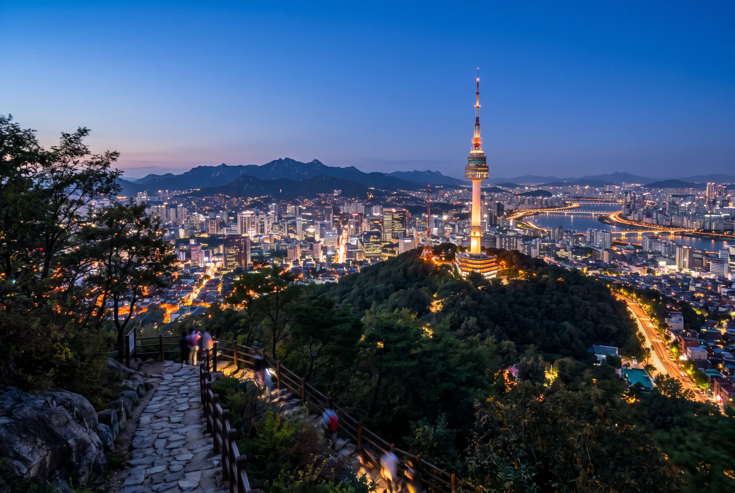 N Seoul Tower on Namsan Mountain above the Seoul skyline at dusk